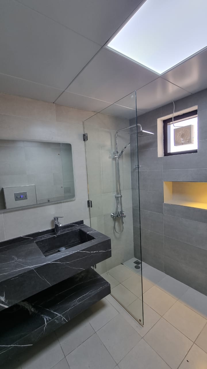 Marble vanity and walk-in shower, Al Rahba