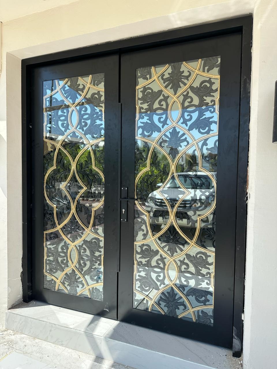 Glass and wrought-iron double entrance door
